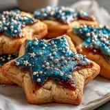 Buttery Gemini Zodiac Cookies adorned with sparkling star royal icing, perfect for cosmic treats.