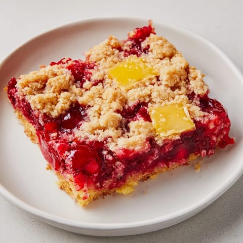 Warm, fruity Dump Cake with a golden crust and melting butter, a comforting dessert photo.