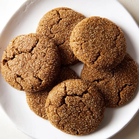 Freshly baked molasses cookies with a hint of cinnamon, perfect with a warm drink.