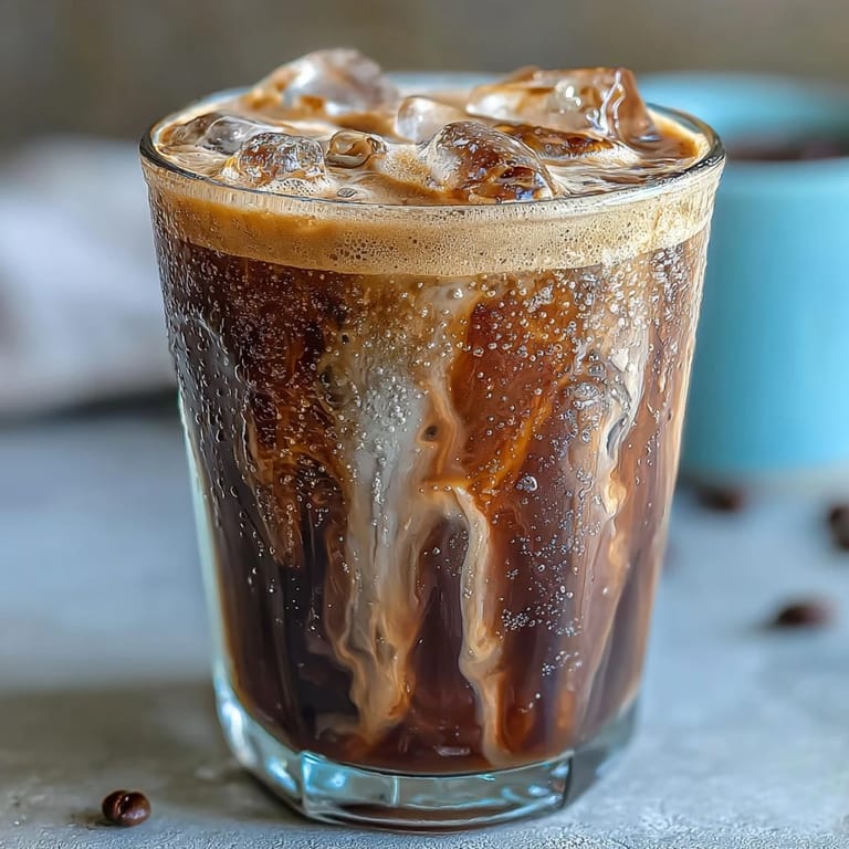 Velvety brown sugar oat milk shaken espresso with rich espresso and frothy oat milk, served over ice for a dairy-free treat.